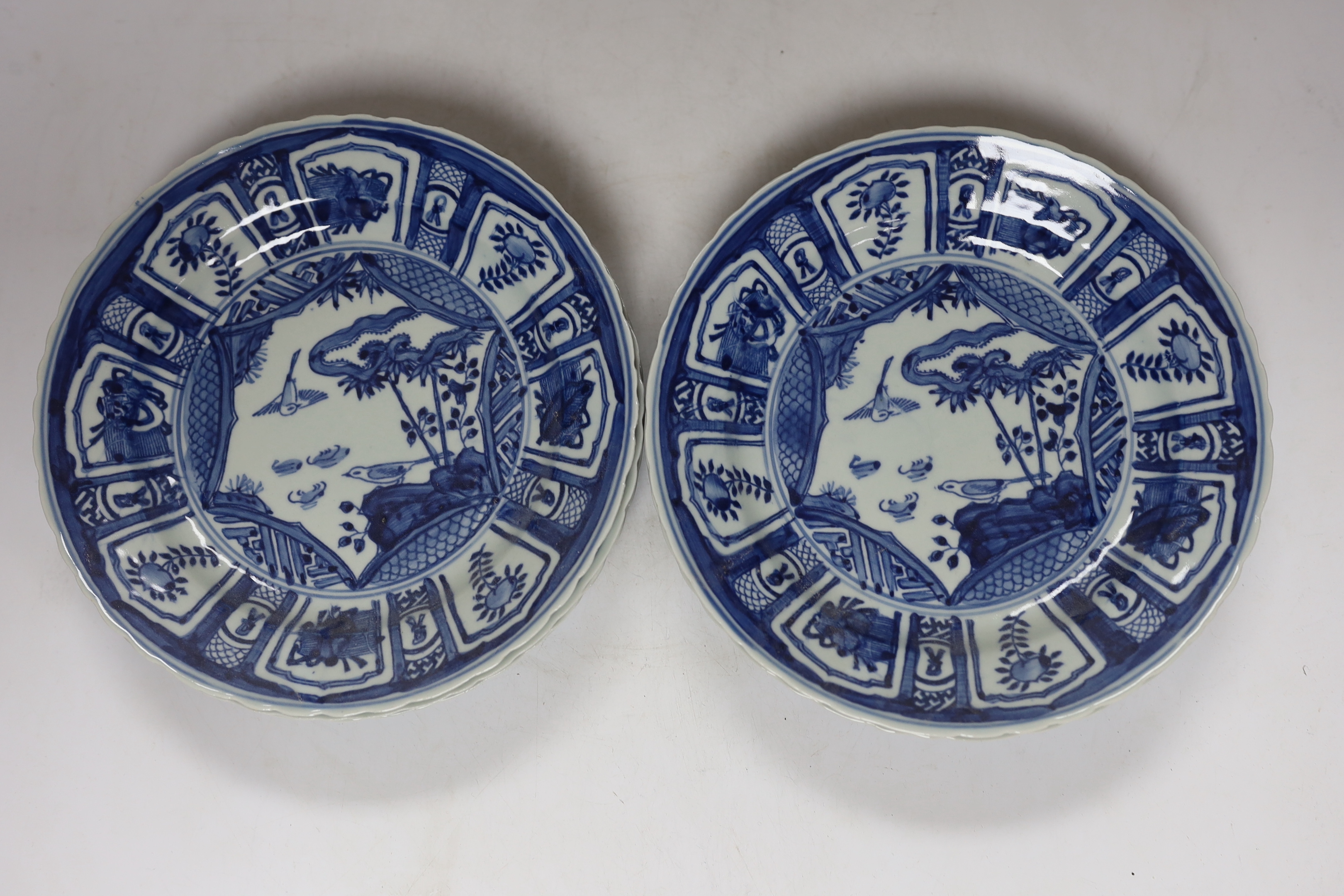 A group of Chinese blue and white dishes and plates and a damaged vase, 30cm